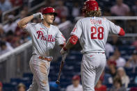 Philadelphia Phillies J.T. Realmuto celebrates with teammate Alec Bohm (28) after scoring a home run during the seventh inning of a baseball game against the Washington Nationals in Washington, Tuesday, Aug. 3, 2021. (AP Photo/Manuel Balce Ceneta)