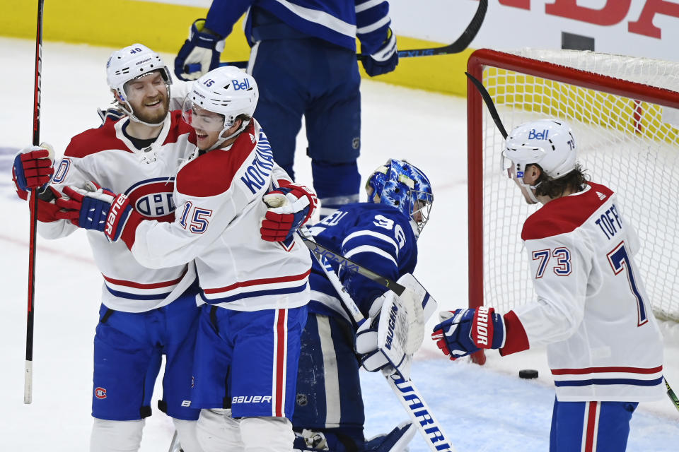 Montreal Canadiens forward Jesperi Kotkaniemi (15) celebrates his goal against Toronto Maple Leafs goaltender Jack Campbell (36) with forwards Joel Armia (40) and Tyler Toffoli (73) during the first period of Game 2 of an NHL hockey Stanley Cup first-round playoff series Saturday, May 22, 2021, in Toronto. (Nathan Denette/The Canadian Press via AP)