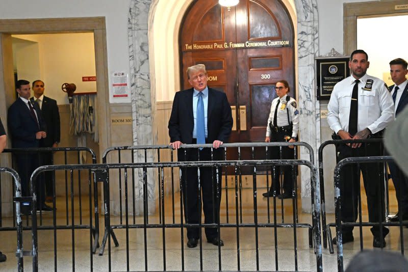During a break in proceedings on Wednesday, Former President Donald Trump speaks to the press after exiting the courtroom during the third week of his civil fraud trial at State Supreme Court on Wednesday in New York City. Photo by Louis Lanzano/UPI