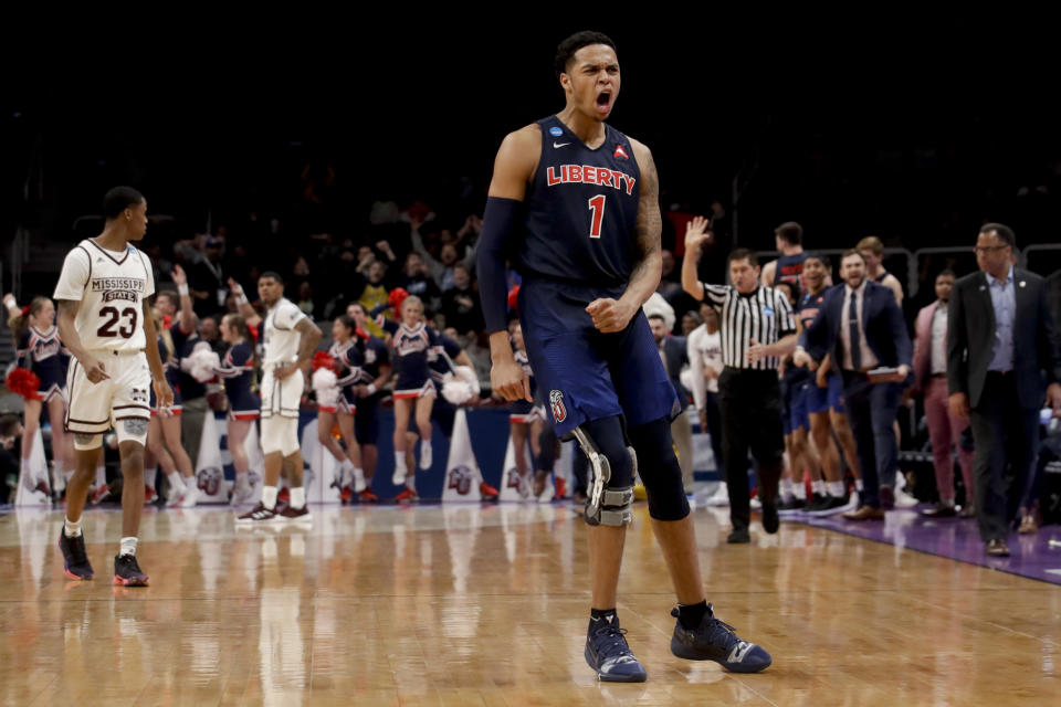 Liberty guard Caleb Homesley celebrates after scoring against Mississippi State during the second half of a first-round game in the NCAA men's college basketball tournament Friday, March 22, 2019, in San Jose, Calif. (AP Photo/Jeff Chiu)