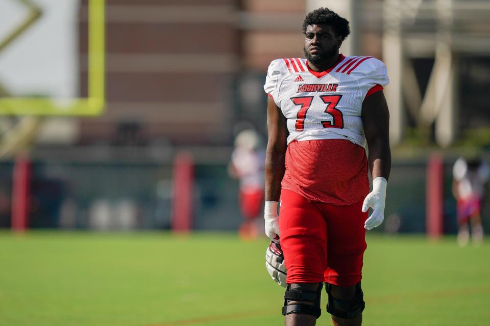 Louisville offensive lineman Mekhi Becton (73) walks onto the field before practice in Louisville, Ky., Wednesday, August 14, 2019. 