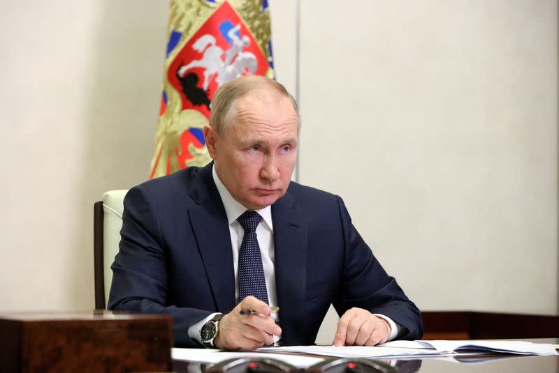 FILE PHOTO: Russian President Putin chairs a meeting outside Moscow