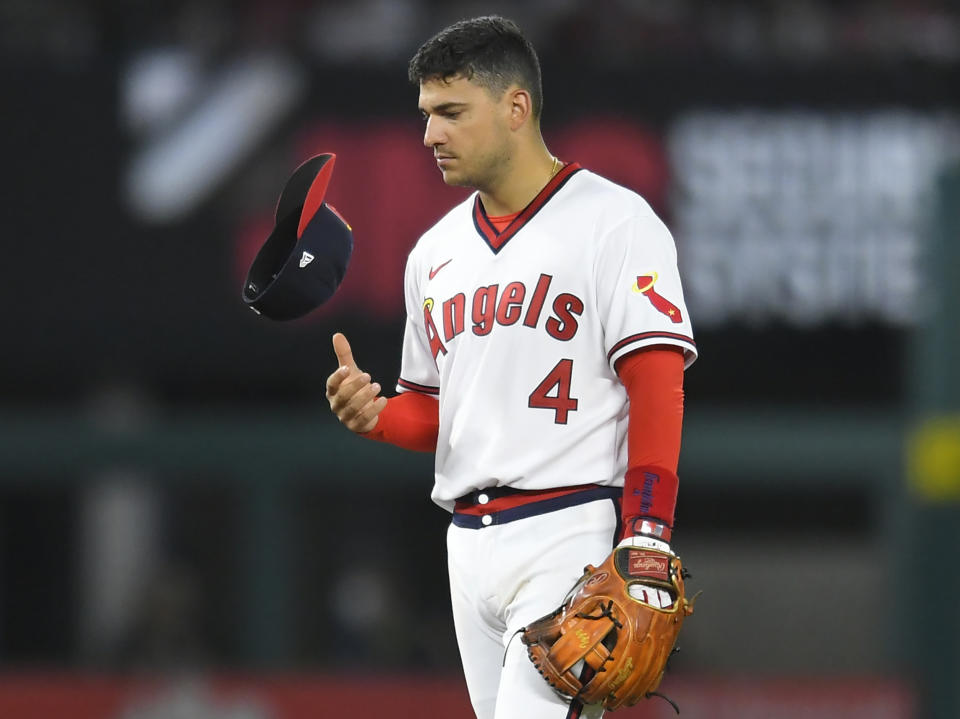 Los Angeles Angels shortstop Jose Iglesias flips his cap during the fourth inning of the team's baseball game against the Oakland Athletics on Friday, July 30, 2021, in Anaheim, Calif. (AP Photo/John McCoy)