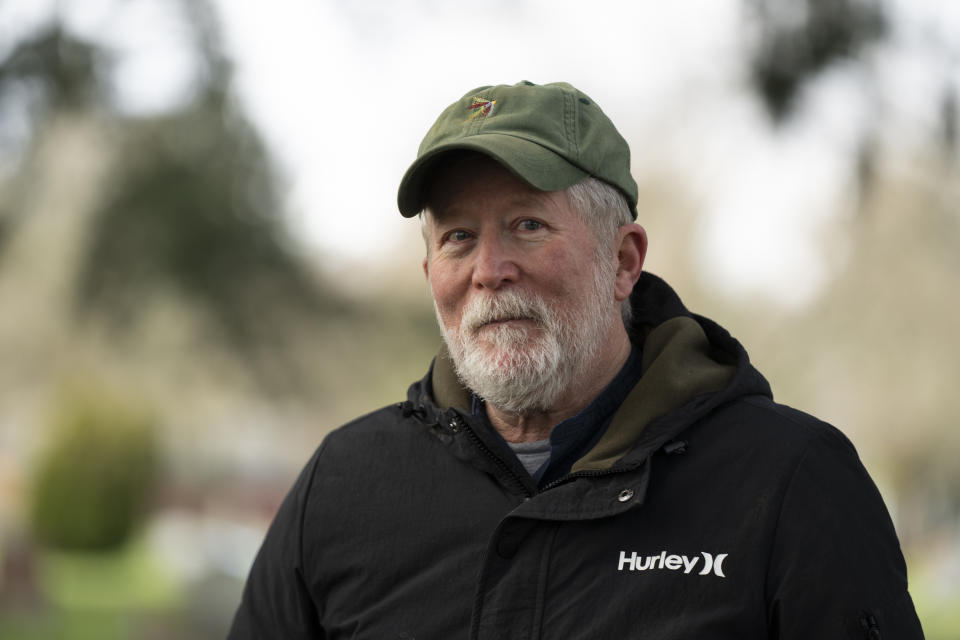 Eric Cordingley visits Multnomah Park Cemetery on Wednesday, March 13, 2024, in Portland, Ore. Cordingley has volunteered at his neighborhood cemetery for about 15 years. He's done everything from cleaning headstones to trying to decipher obscure burial records. He has documented Portland burial sites — Multnomah Park and Greenwood Hills cemeteries — have the most Lost Alaskans, and obtained about 1,200 death certificates. (AP Photo/Jenny Kane)