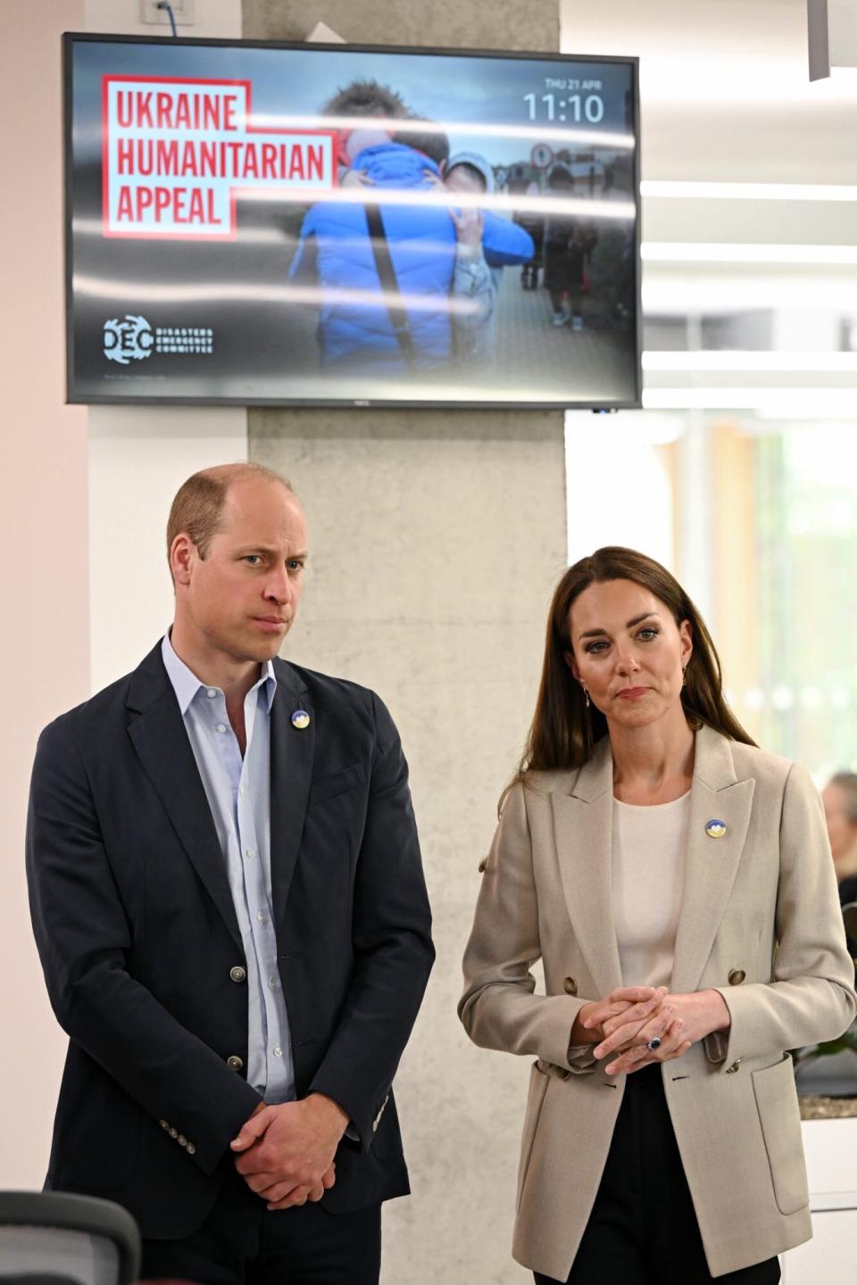 Prince William, Duke of Cambridge and Catherine, Duchess of Cambridge tour the facilities during a visit at the London headquarters of the Disasters Emergency Committee (DEC)