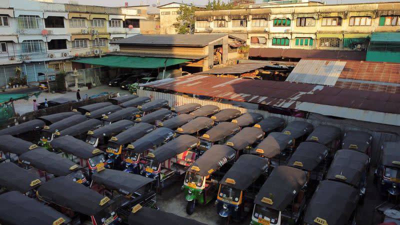 Tuk-tuks that used to transport tourists around the city are seen idle due to travel bans and border closures from the global coronavirus disease (COVID-19) outbreak in a parking lot in downtown Bangkok, Thailand