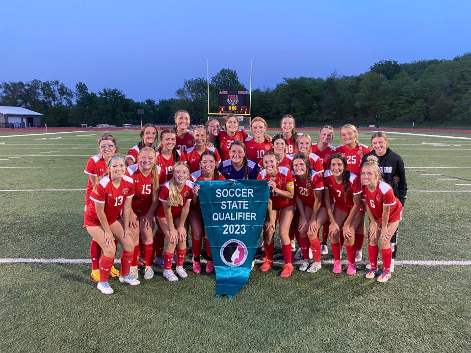The ADM girls soccer team poses for a photo after defeating Glenwood 3-1 and qualifying for state on Thursday, May 25, 2023, in Adel.