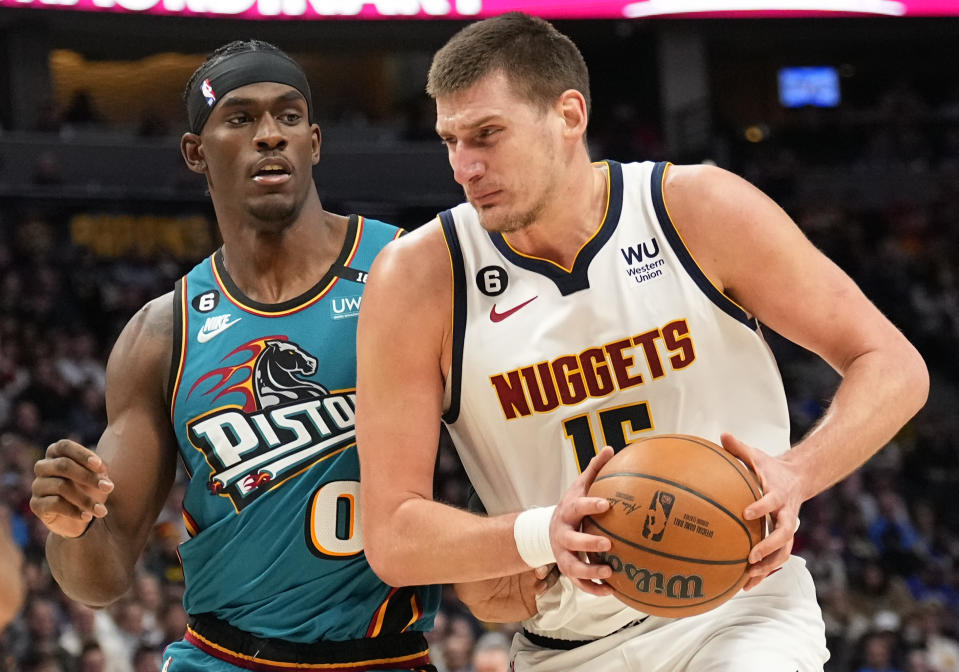 Denver Nuggets center Nikola Jokic drives to the basket against Detroit Pistons center Jalen Duren (0) during the third quarter of an NBA basketball game, Tuesday, Nov. 22, 2022, in Denver. (AP Photo/Jack Dempsey)