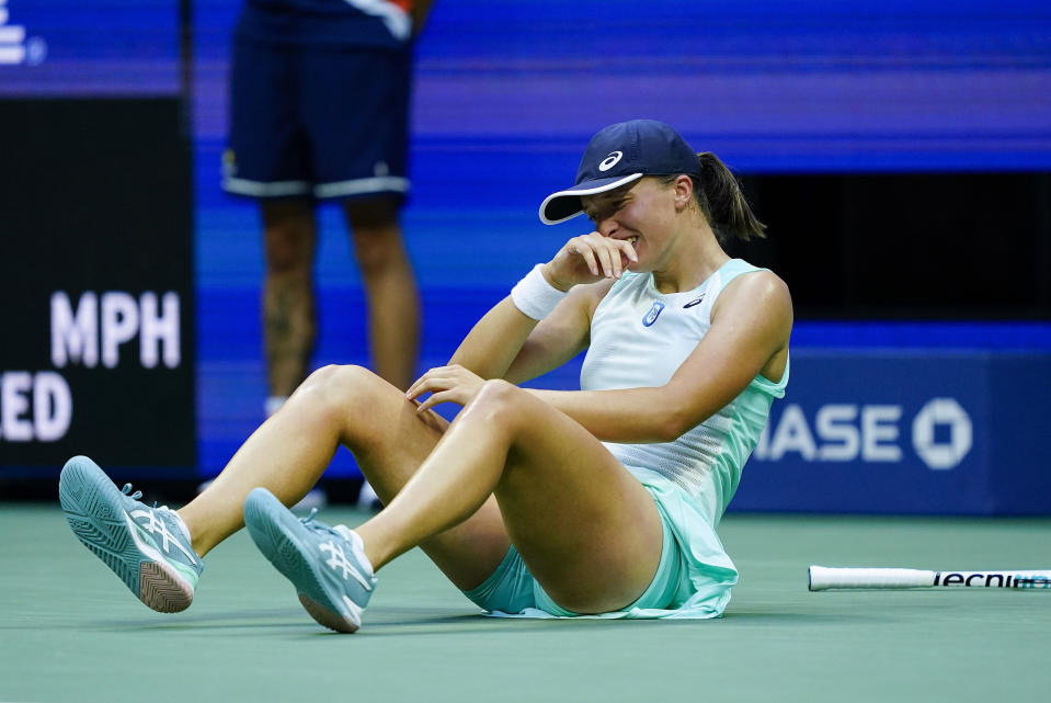Iga Swiatek, of Poland, reacts after defeating Ons Jabeur, of Tunisia, to win the women's singles final of the U.S. Open tennis championships, Saturday, Sept. 10, 2022, in New York. (AP Photo/Matt Rourke)