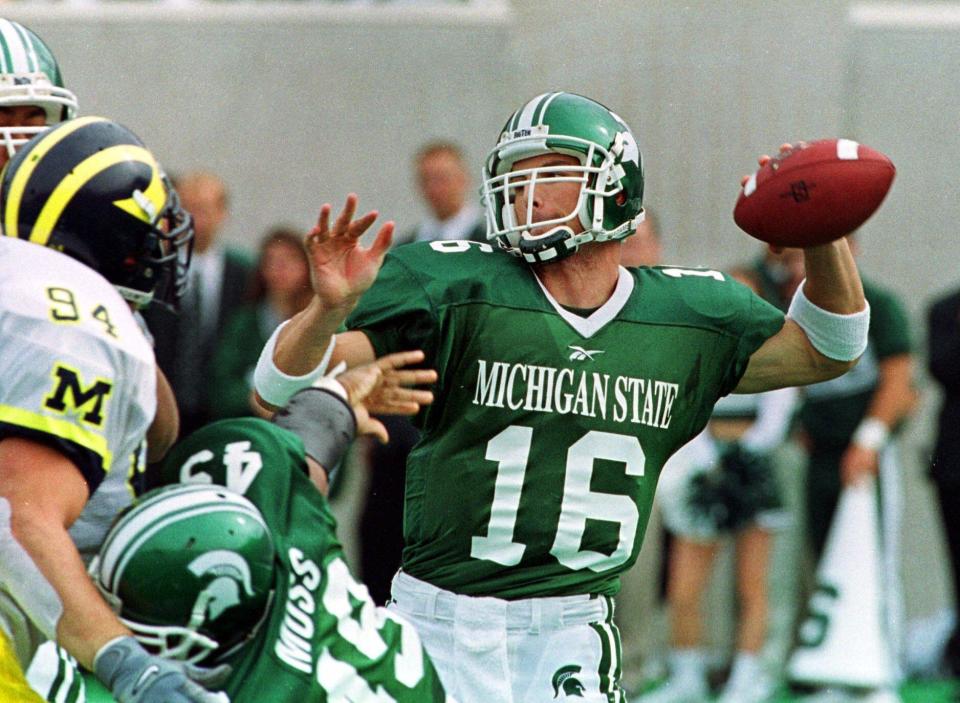 Michigan State quarterback Bill Burke (16) prepares to thrown downfield during the second quarter against the University of Michigan at Spartan Stadium in East Lansing, Mich., Saturday, Oct. 9, 1999. Burke passed for 400 yards and two touchdowns as the No. 11 Spartans held off third-ranked Michigan 34-31 in their showdown of Big Ten unbeatens.