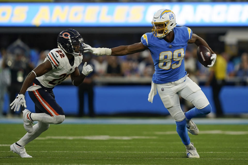 Los Angeles Chargers tight end Donald Parham Jr. runs with the ball as Chicago Bears defensive back Elijah Hicks defends during the first half of an NFL football game Sunday, Oct. 29, 2023, in Inglewood, Calif. (AP Photo/Ryan Sun)