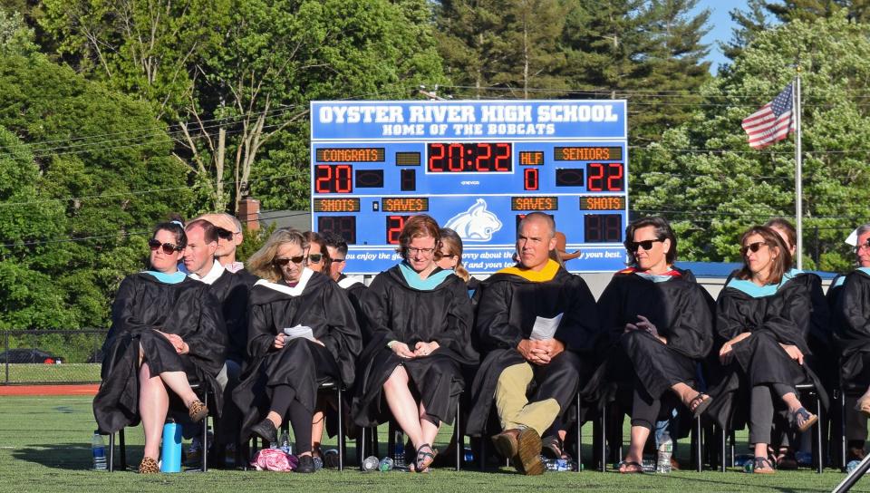 Oyster River High School faculty observe the ceremony for the Class of 2022 on Friday, June 10, 2022 at the high school in Durham.