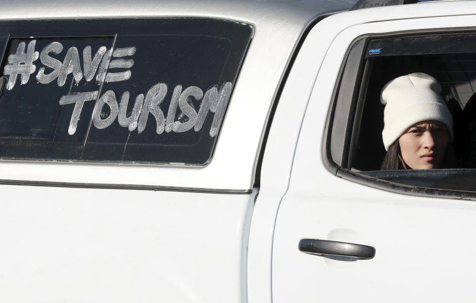 Tour operators take part in a protest in Cape Town, South Africa, Friday July 31, 2020. Various tourism operators staged a slow drive protest as they struggle to make ends meet under the COVID-19 lockdown regulations. (Photo/Nardus Engelbrecht)