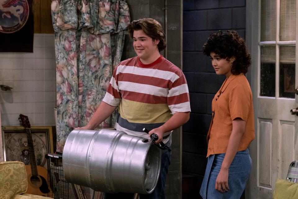 Nate (Maxwell Acee Donovan, left, with Sam Morelos as Nikki) winds up with a keg of beer but no tap in a scene from "That ‘90s Show."