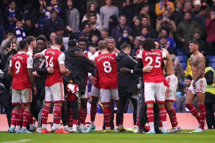 Arsenal’s players celebrate after their 1-0 win at Chelsea (John Walton/PA) (PA Wire)