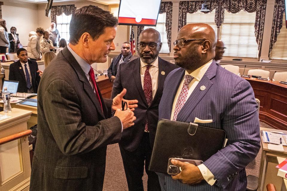From left, Senator Trey Paradee, has a talk with of Delaware State University's Chief Operating Officer Cleon Cauley, Esq. and President Dr. Tony Allen, at the conclusion of DSU's state budget hearing at Legislative Hall in Dover, Thursday, Feb. 2, 2023.
