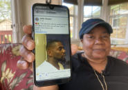 Glenda Brown Thomas displays a photo of her nephew, Andrew Brown Jr., on her cell phone at her home in Elizabeth City, N.C., on Thursday, April 22, 2021. Brown was shot and killed Wednesday by a sheriff's deputy, who was attempting to execute a warrant. (AP Photo/Allen G. Breed)