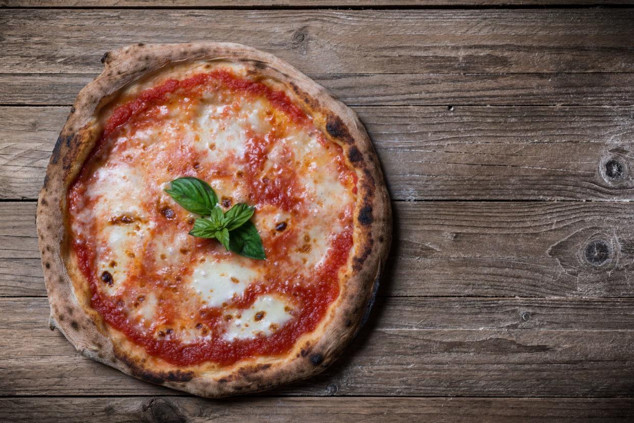 <p><br></p><p>Naples obviously isn’t in America, but we’d be remiss if we didn’t include the birthplace of pizza on this list! Traditional <a href="https://www.goldbelly.com/foods/neapolitan-pizza" rel="nofollow noopener" target="_blank" data-ylk="slk:Neapolitan pizza;elm:context_link;itc:0;sec:content-canvas" class="link rapid-noclick-resp">Neapolitan pizza</a> has a soft & puffy ring of crust surrounding tomato sauce and dollops of mozzarella and few other toppings, with a slightly soupy center. It’s the pizza from which all other pizzas originated, and here in the U.S. including:</p><ul><li>San Francisco’s <a href="https://www.goldbelly.com/restaurants/pizzeria-delfina" rel="nofollow noopener" target="_blank" data-ylk="slk:Pizzeria Delfina;elm:context_link;itc:0;sec:content-canvas" class="link rapid-noclick-resp">Pizzeria Delfina</a></li><li>Phoenix’s <a href="https://www.goldbelly.com/restaurants/pizzeria-bianco" rel="nofollow noopener" target="_blank" data-ylk="slk:Pizzeria Bianco;elm:context_link;itc:0;sec:content-canvas" class="link rapid-noclick-resp">Pizzeria Bianco</a></li><li>LA’s <a href="https://www.goldbelly.com/restaurants/pizzana" rel="nofollow noopener" target="_blank" data-ylk="slk:Pizzana;elm:context_link;itc:0;sec:content-canvas" class="link rapid-noclick-resp">Pizzana</a></li><li>New York’s <a href="https://www.goldbelly.com/restaurants/motorino-pizzeria" rel="nofollow noopener" target="_blank" data-ylk="slk:Motorino;elm:context_link;itc:0;sec:content-canvas" class="link rapid-noclick-resp">Motorino</a></li></ul><span class="copyright"> Jef_M/Istockphoto </span>