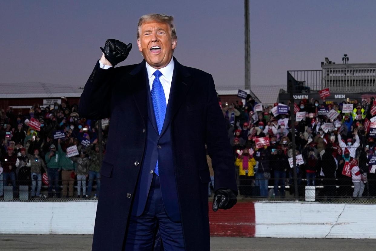 Donald Trump gestures with raised fist