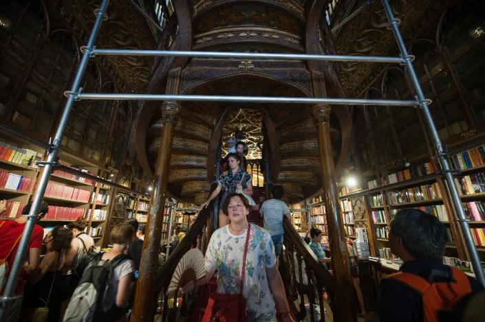 Lello's fine staircase will emerge once again after being clad in scaffolding since April (AFP Photo/Miguel Riopa)