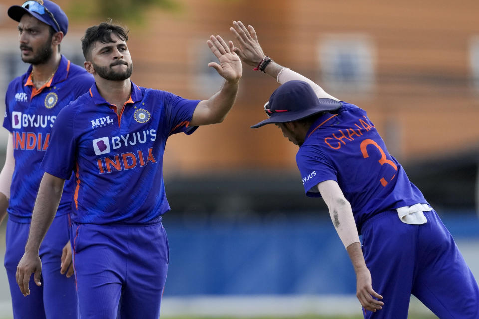 India's Shardul Thakur, left, celebrates with teammate India's Yuzvendra Chahal after dismissing West Indies' Keacy Carty during the third ODI cricket match at Queen's Park Oval in Port of Spain, Trinidad and Tobago, Wednesday, July 27, 2022. (AP Photo/Ricardo Mazalan)