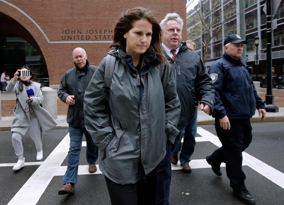 Former University of Southern California soccer coach Laura Janke departs federal court, Tuesday, May 14, 2019, in Boston, where she pleaded guilty to charges in a nationwide college admissions bribery scandal. (AP Photo/Steven Senne) ORG XMIT: BX104