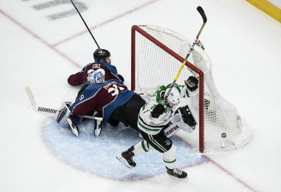 Dallas Stars' Alexander Radulov (47) celebrates his goal against Colorado Avalanche goalie Pavel Francouz as Avalanche's Ian Cole (28) looks on during second-period NHL Western Conference Stanley Cup playoff hockey game action in Edmonton, Alberta, Saturday, Aug. 22, 2020. (Jason Franson/The Canadian Press via AP)