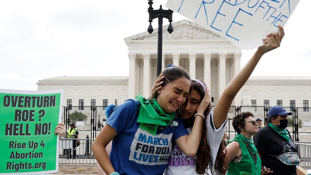 washington, dc june 24 abortion rights activists carrie mcdonald l and soraya bata react to the dobbs v jackson women’s health organization ruling which overturns the landmark abortion roe v wade case in front of the us supreme court on june 24, 2022 in washington, dc photo by anna moneymakergetty images