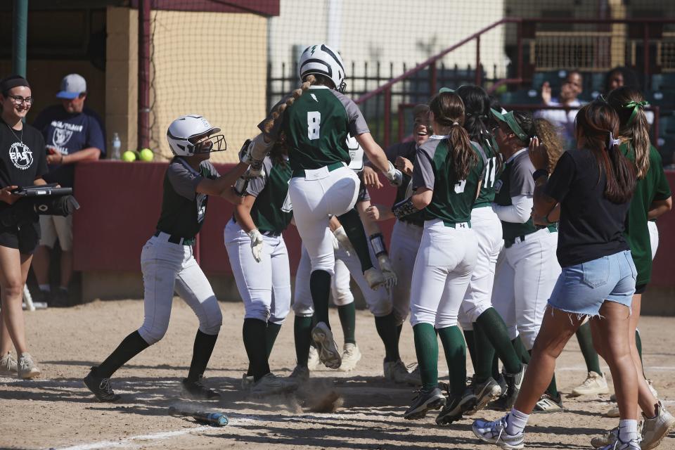 Cranston East's Izzy Souza is welcomed to home plate after hitting a grand slam against Pawtucket on Saturday at Rhode Island College. 6-1-24