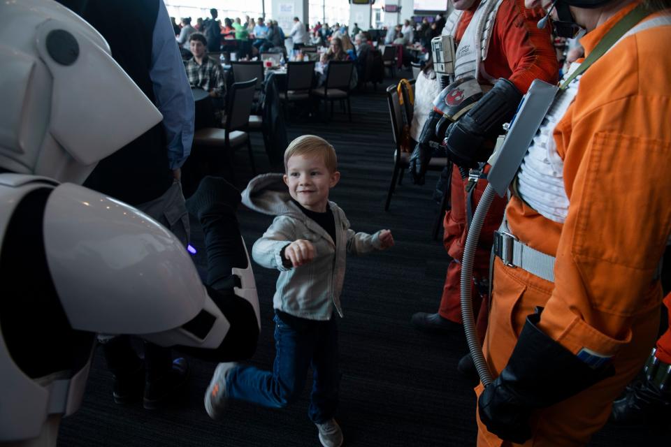 Connor Glosson, 4, greets members of the Rebel Legion and 501st Legion during a lunch event for children from Our Kids, a nonprofit serving children and families affected by child sexual abuse at Nissan Stadium in Nashville , Tenn., Sunday, Feb. 19, 2023.
