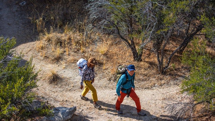 <span class="article__caption">Atim Enyenihi, left, and Cody Kaemmerlen at Idaho's City of Rocks National Reserve. The California Trail, an offshoot of the Oregon Trail from the Raft River, 50 miles away, passed through here. At City of Rocks, as in other locations, settlers wrote their names in axel grease on the rocks. </span>(Photo: Nikki Smith/Pull Photography)