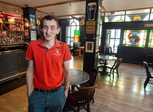 Brendan Doherty, co-owner of the Old Triangle Irish Alehouse in Halifax, is shown last June. The pub is limiting table sizes to groups of six people at the most, and bringing in a sick-day policy for those being tested. (Andrew Vaughan/The Canadian Press - image credit)