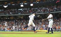 May 23, 2018; Houston, TX, USA; San Francisco Giants starting pitcher Jeff Samardzija (left) reacts as Houston Astros right fielder George Springer (4) celebrates with third base coach Gary Pettis (8) after hitting a home run during the fifth inning at Minute Maid Park. Mandatory Credit: Troy Taormina-USA TODAY Sports