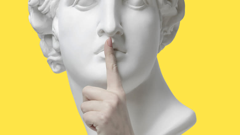 statue with finger of silence