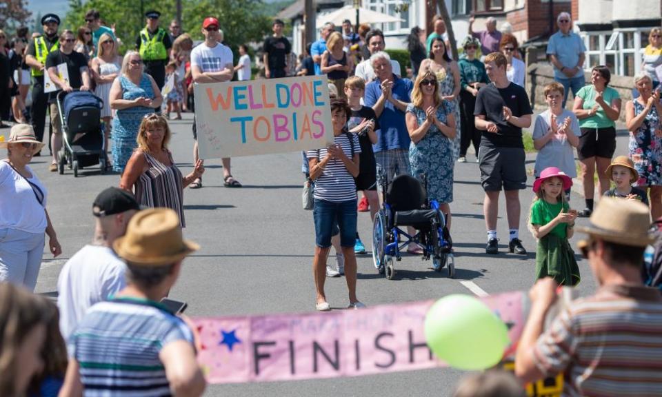 Neighbours cheer on Tobias Weller.