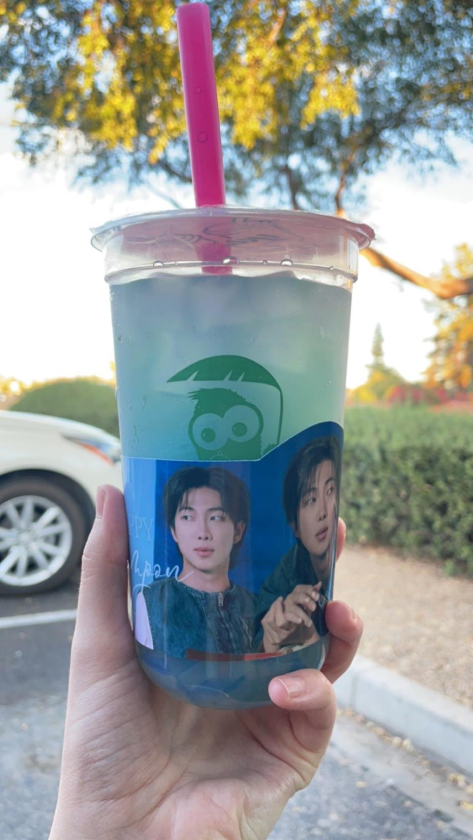 A lychee peach soda with lychee jelly featuring a cup sleeve for BTS' RM at Teazona in Phoenix on Sept. 23, 2023.