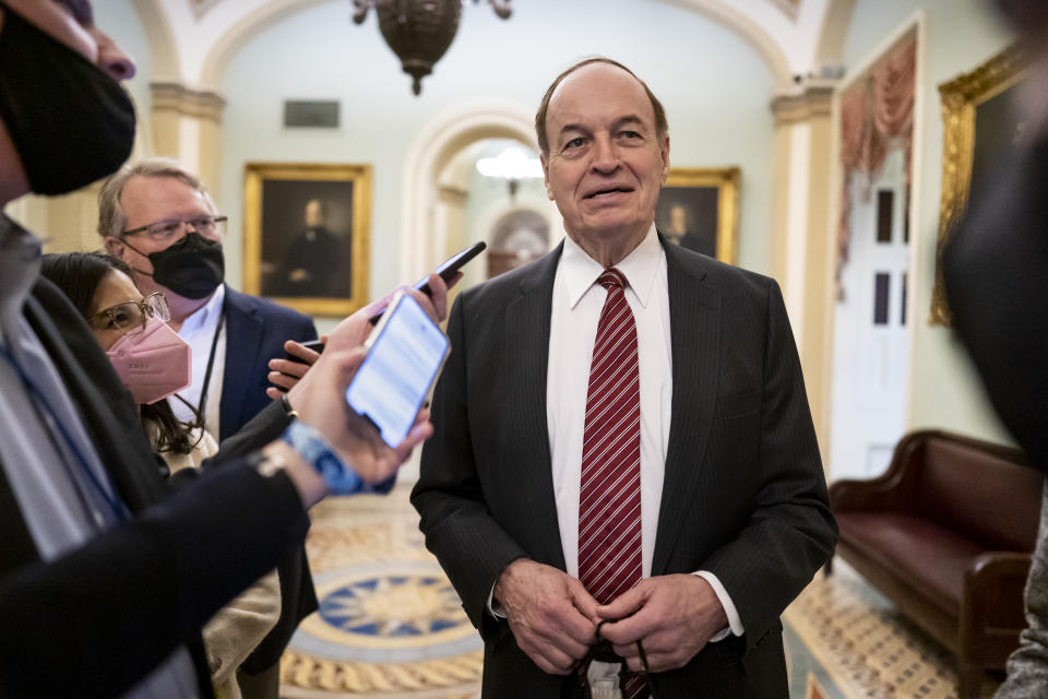 Sen. Richard Shelby, R-Ala., top Republican on the Senate Appropriations Committee, stops to answers reporters at the Capitol in Washington, Wednesday, Dec. 1, 2021. (AP Photo/J. Scott Applewhite)