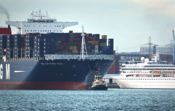 SOUTHAMPTON, ENGLAND - DECEMBER 10: The Marco Polo, the world's biggest container ship, towers over the Braemar cruise liner as she leaves Southampton docks on December 10, 2012 in England. On its first visit to Europe, the 54m (177ft) wide and 396m (1299ft) long container ship - which is 51m (167ft) longer than the Queen Mary II - will mostly carry consumer goods for delivery to shops for Christmas. (Photo by Peter Macdiarmid/Getty Images)