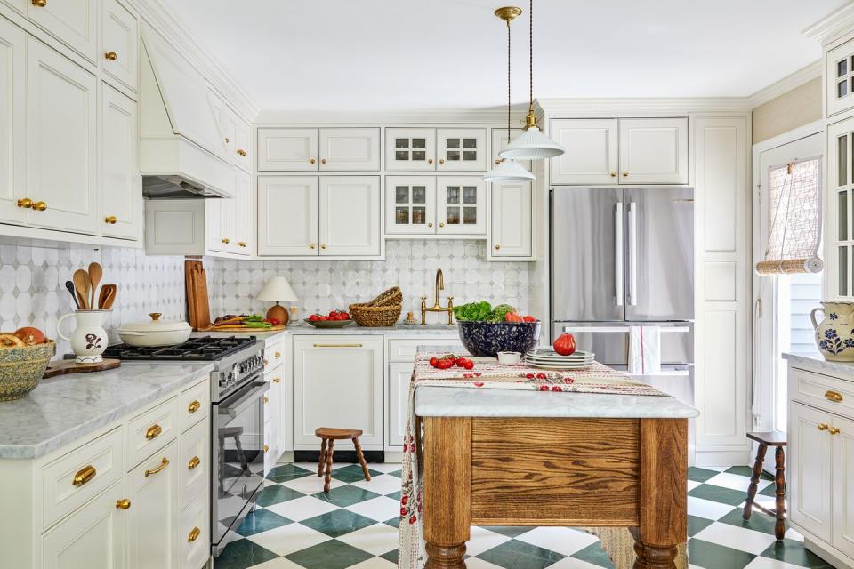 white kitchen with green and white checkered floors, oak island with white marble top