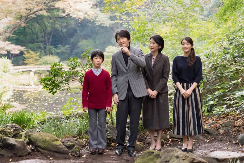 FILE PHOTO: Japan's Prince Akishino and his wife Princess Kiko stroll in the garden for a family photo with their children Prince Hisahito and Princess Mako, at their residence in Tokyo