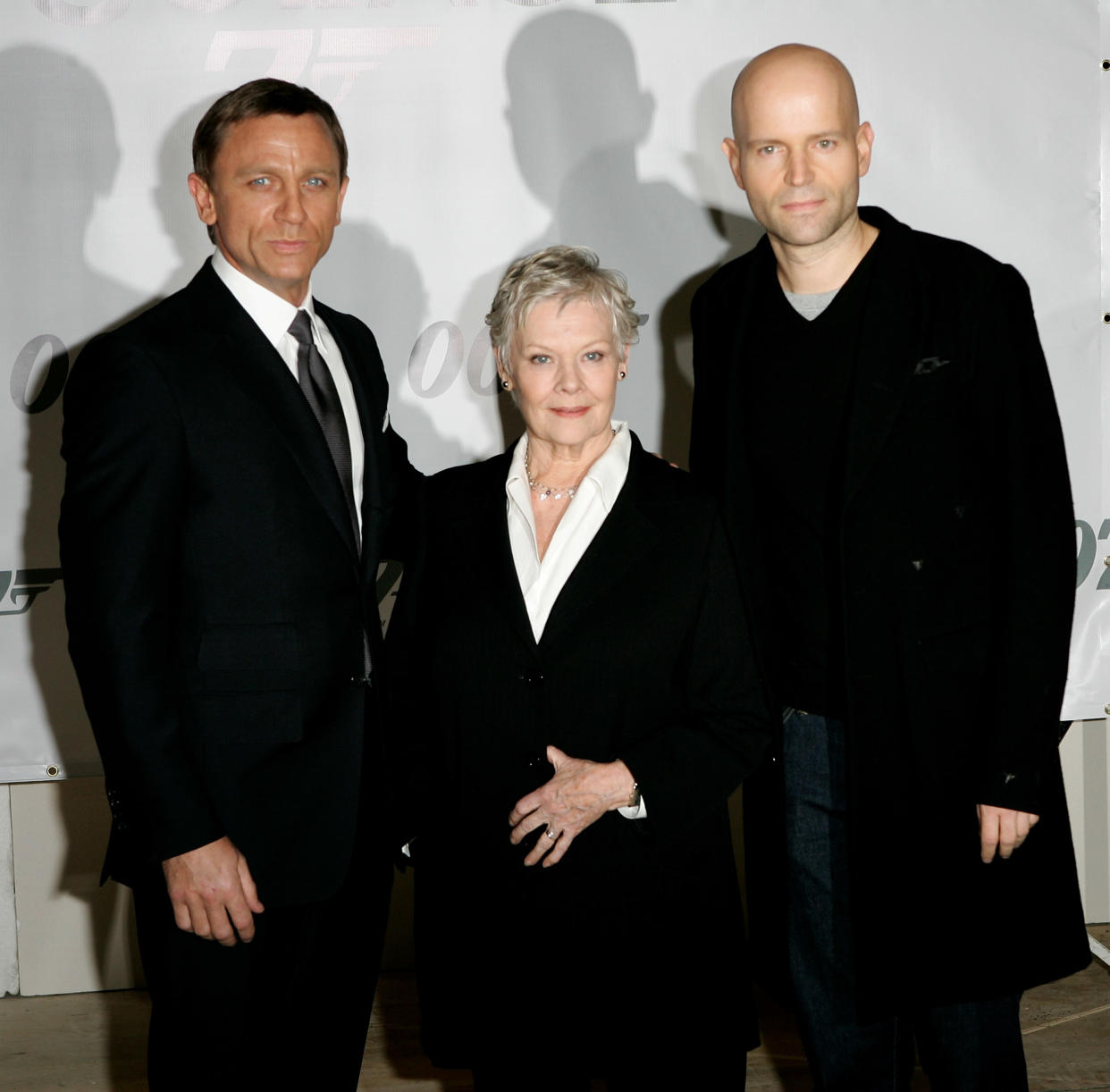 LONDON - JANUARY 24:  Actors Daniel Craig (L) and Dame Judi Dench and director Marc Forster attend a photocall to celebrate the start of production of the 22nd James Bond film 'Quantum of Solace' at Pinewood Studios on January 24, 2007 near London, England.  (Photo by Rosie Greenway/Getty Images)