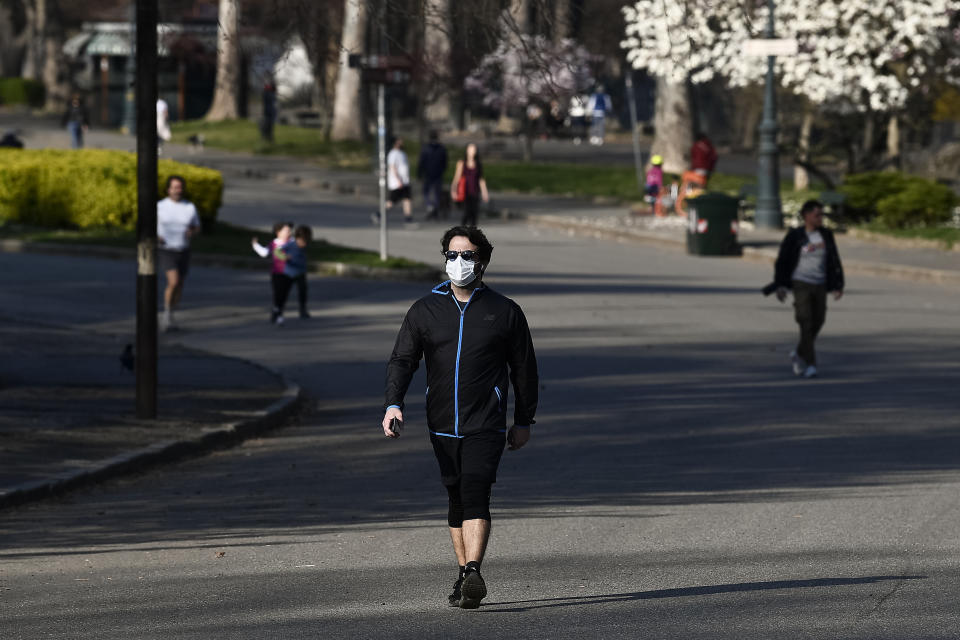 TURIN, ITALY - March 18, 2020: A person walks in a park. The Italian government imposed unprecedented restrictions to halt the spread of COVID-19 coronavirus outbreak, among other measures people movements are allowed only for work, for buying essential goods and for health reasons. walking and playing sports is allowed but not recommended, furthermore it's recommend to take your dog out only for the minimum amount of time needed. Some cities have closed parks Minister for Sport and Youth Policies Vincenzo Spadafora said that the Italian government is considering banning outdoor physical activity. (Photo by Nicol� Campo/Sipa USA)