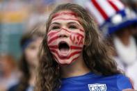 Jun 22, 2015; Edmonton, Alberta, CAN; United States fan Bella Jandreski, 14, of San Diego, CA cheers before the game against the Colombia in the round of sixteen in the FIFA 2015 women's World Cup soccer tournament at Commonwealth Stadium. Mandatory Credit: Michael Chow-USA TODAY Sports -