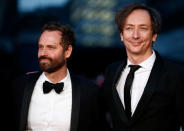 Composers Volker Bertelmann (R) and Dustin O'Halloran pose as they arrive for the gala screening of the film "Lion", during the 60th British Film Institute (BFI) London Film Festival at Leicester Square in London, Britain October 12, 2016. REUTERS/Peter Nicholls