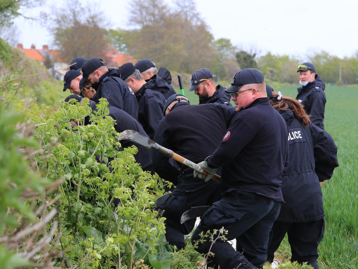 Police officers continue their search of fields close to the hamlet of Snowdown (PA)