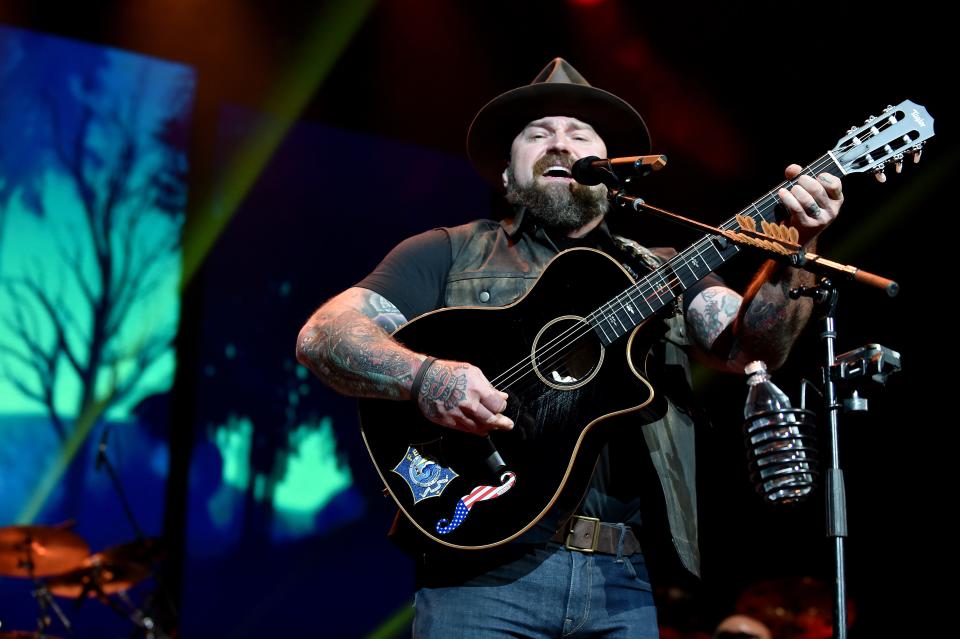 Zac Brown Band pauses their tour after the lead singer tests positive for COVID-19.