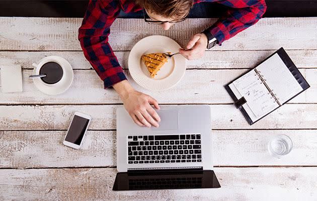 Eating while you're watching something can get your body in a routine of expecting food in similar situations. Photo: Getty images