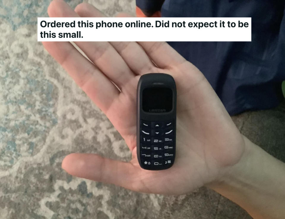 phone fits inside the palm of a hand