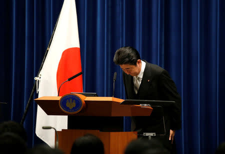 Japan's Prime Minister Shinzo Abe bows at a news conference after deciding on his cabinet following parliament reconvening after the general election, at his official residence in Tokyo, Japan November 1, 2017. REUTERS/Toru Hanai