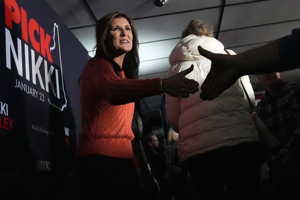 Republican presidential candidate former UN Ambassador Nikki Haley shakes hands with guests at a V.F.W. hall during a campaign stop, Monday, Jan. 22, 2024, in Franklin, N.H. (AP)